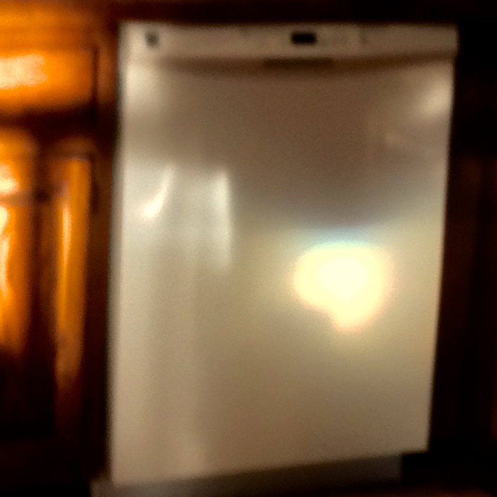 Blurry photo of sunset projected on my dishwasher
